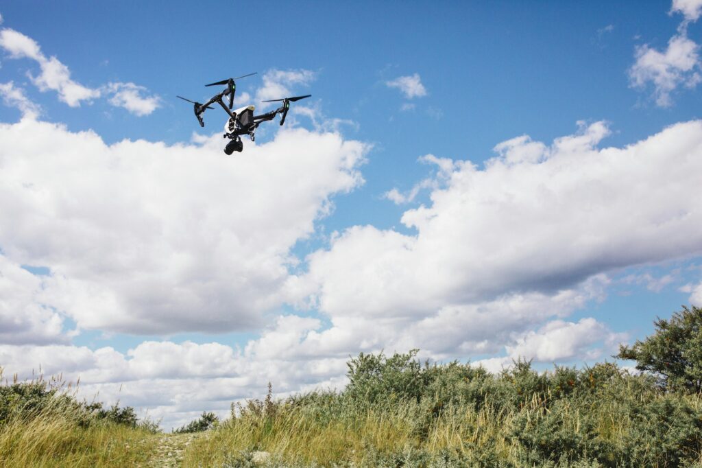 Drone flying over field